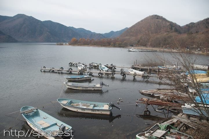 Boats at Shobugahama pier, Lake Chuzenji south shore, camping area in background, Nikko