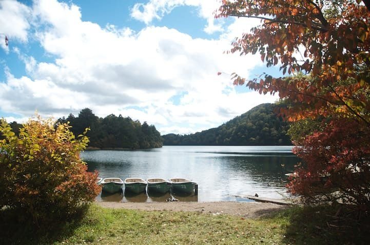 Autumn leaves reflected on Lake Yu Yunoko, Yumoto Onsen, Nikko Japan