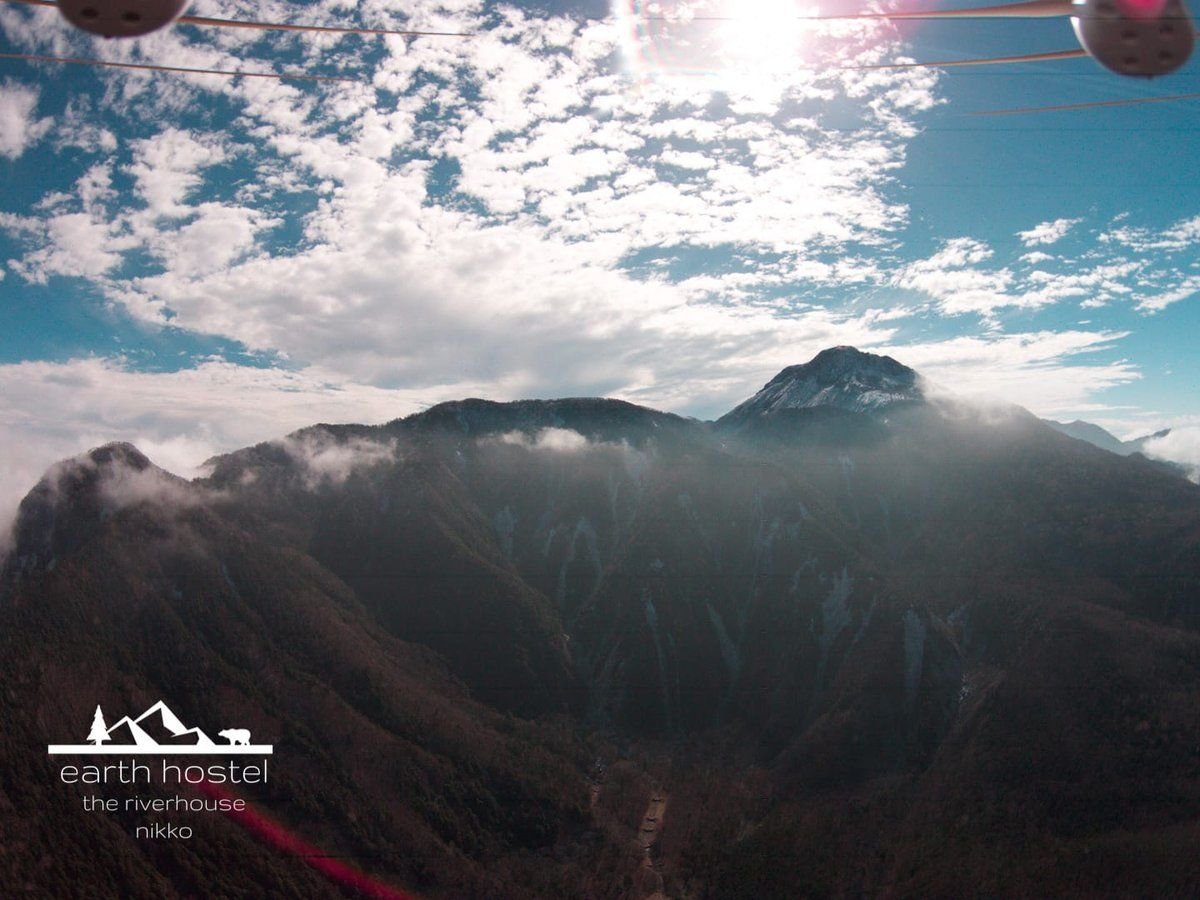 Hikers trekking across Mount Shirane near Nikko, Japan