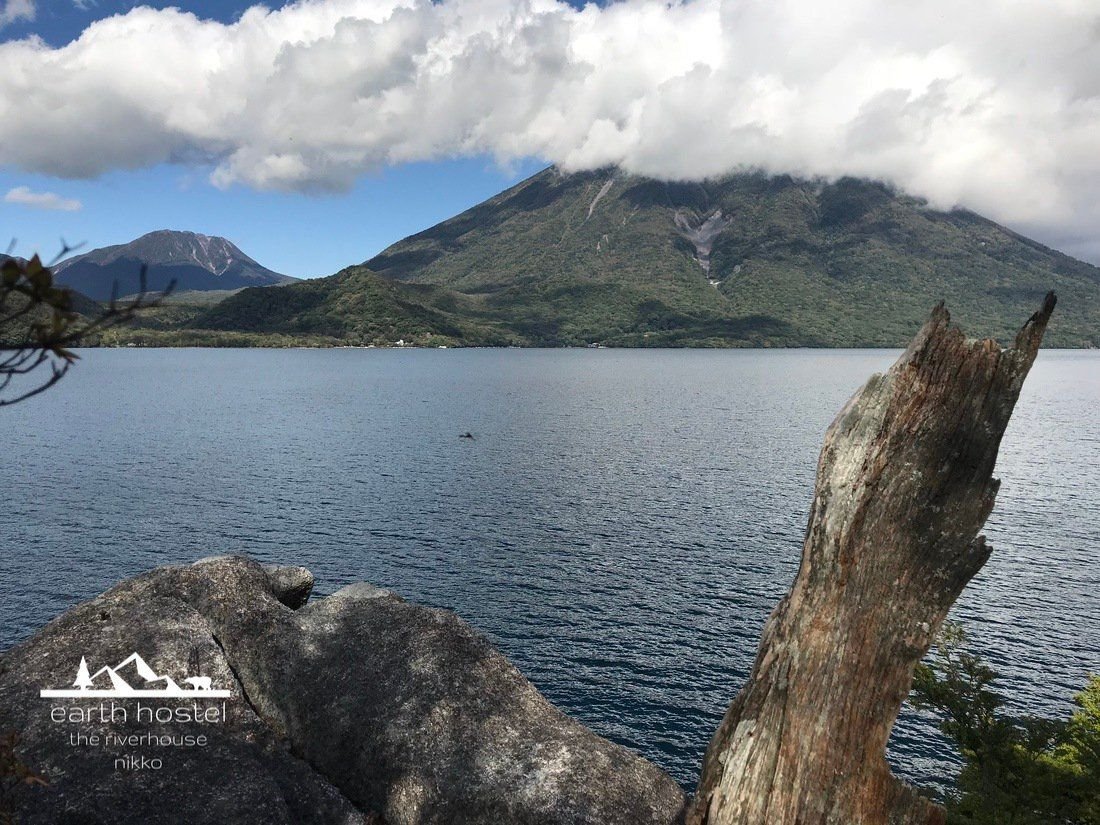 Nantai Mountain viewed from cliff on Lake Chuzenji south shore hiking trail, 100m above the lake, Nikko National Park