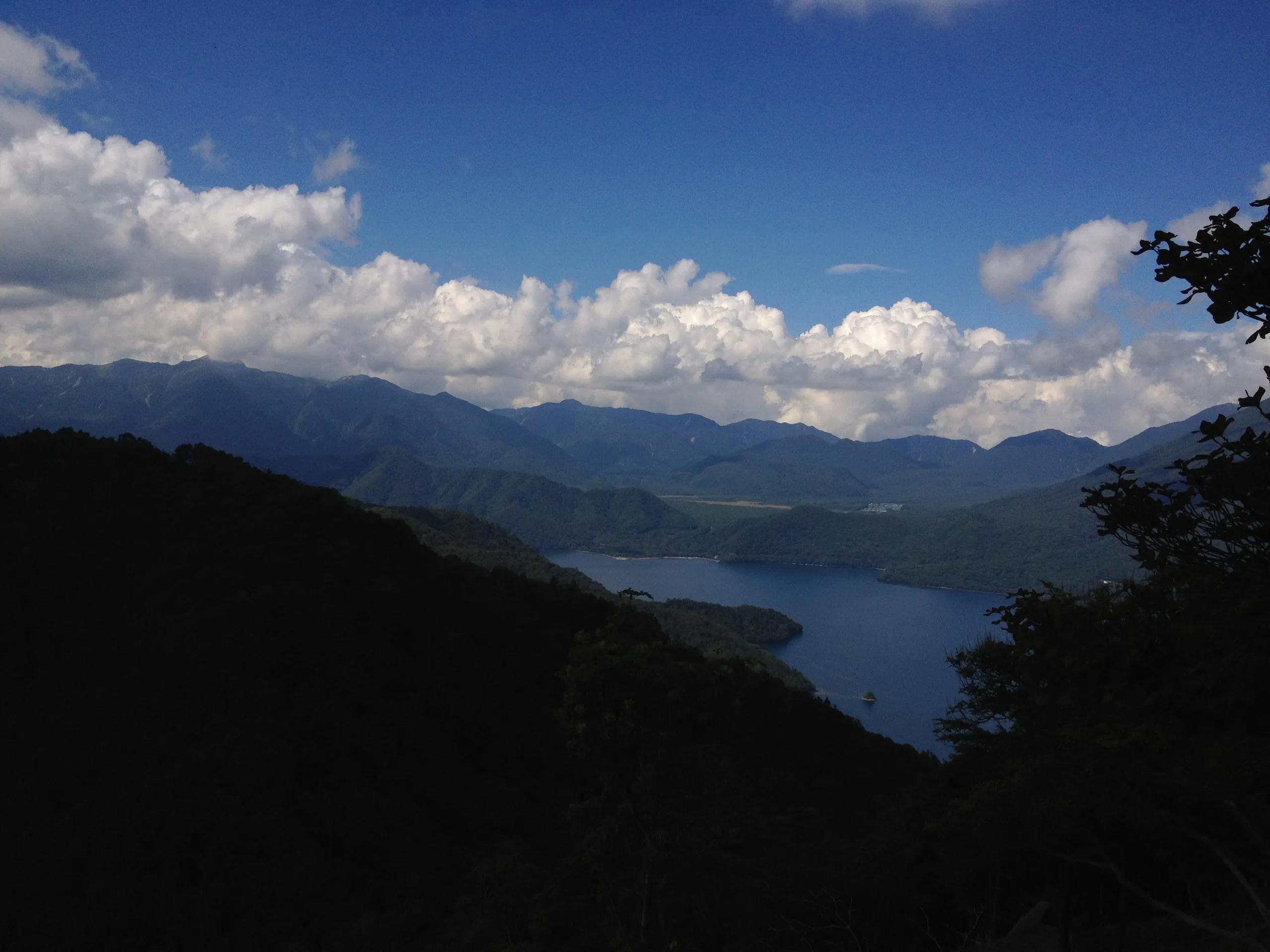 Lake Chuzenji through the trees on the ascent from the Kegon Falls trailhead, Hangetsu hiking trail, Nikko Japan