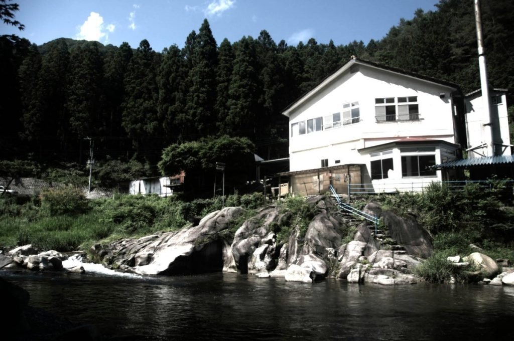 Earth Hostel Nikko Riverhouse — backpacker hostel on the Kurokawa River, mountains of Nikko, Japan