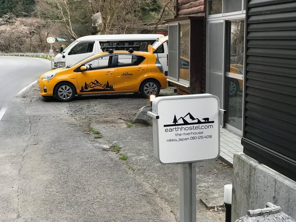 Earth Hostel yellow shuttle bus, Nikko Japan