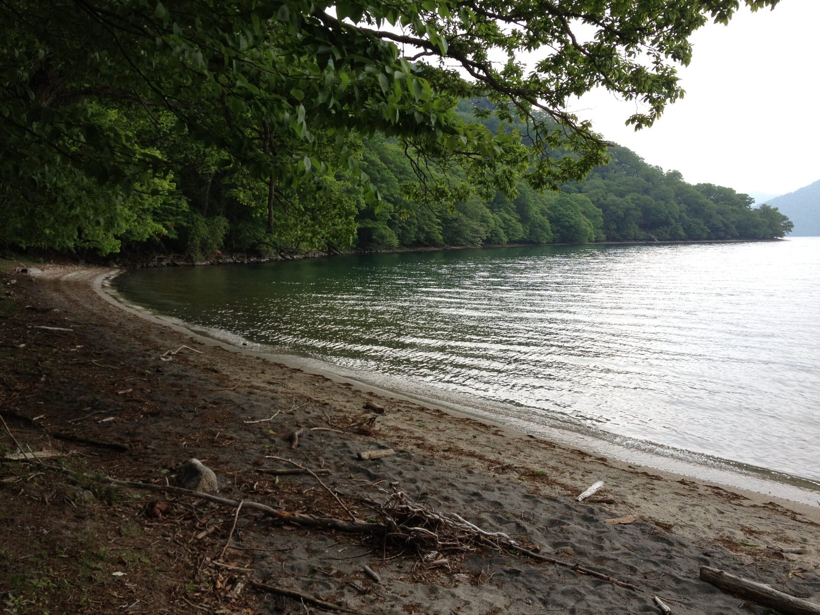Beach at Kumakubo cove on the north shore of Lake Chuzenji, Takayama hiking trail, Nikko Japan
