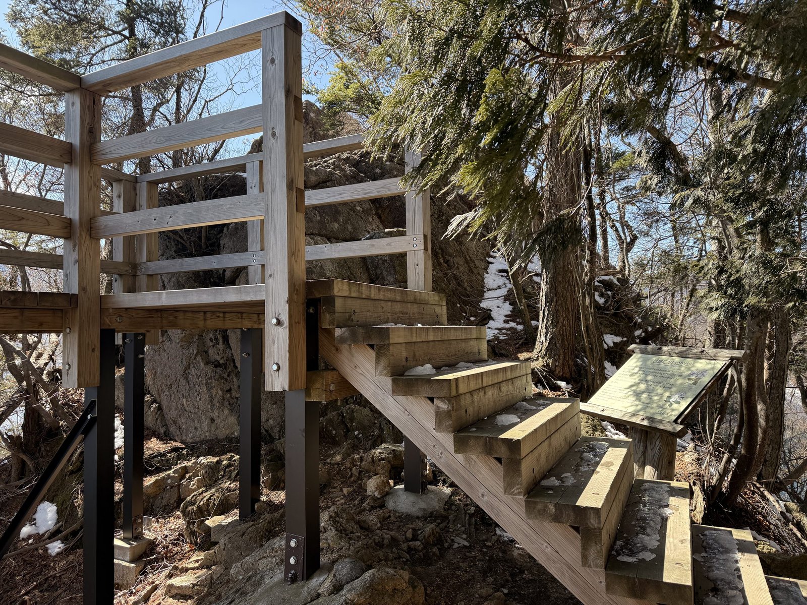 Timber steps climbing to the viewing platform at Aka-iwa, Lake Chuzenji north shore trail, Nikko Japan