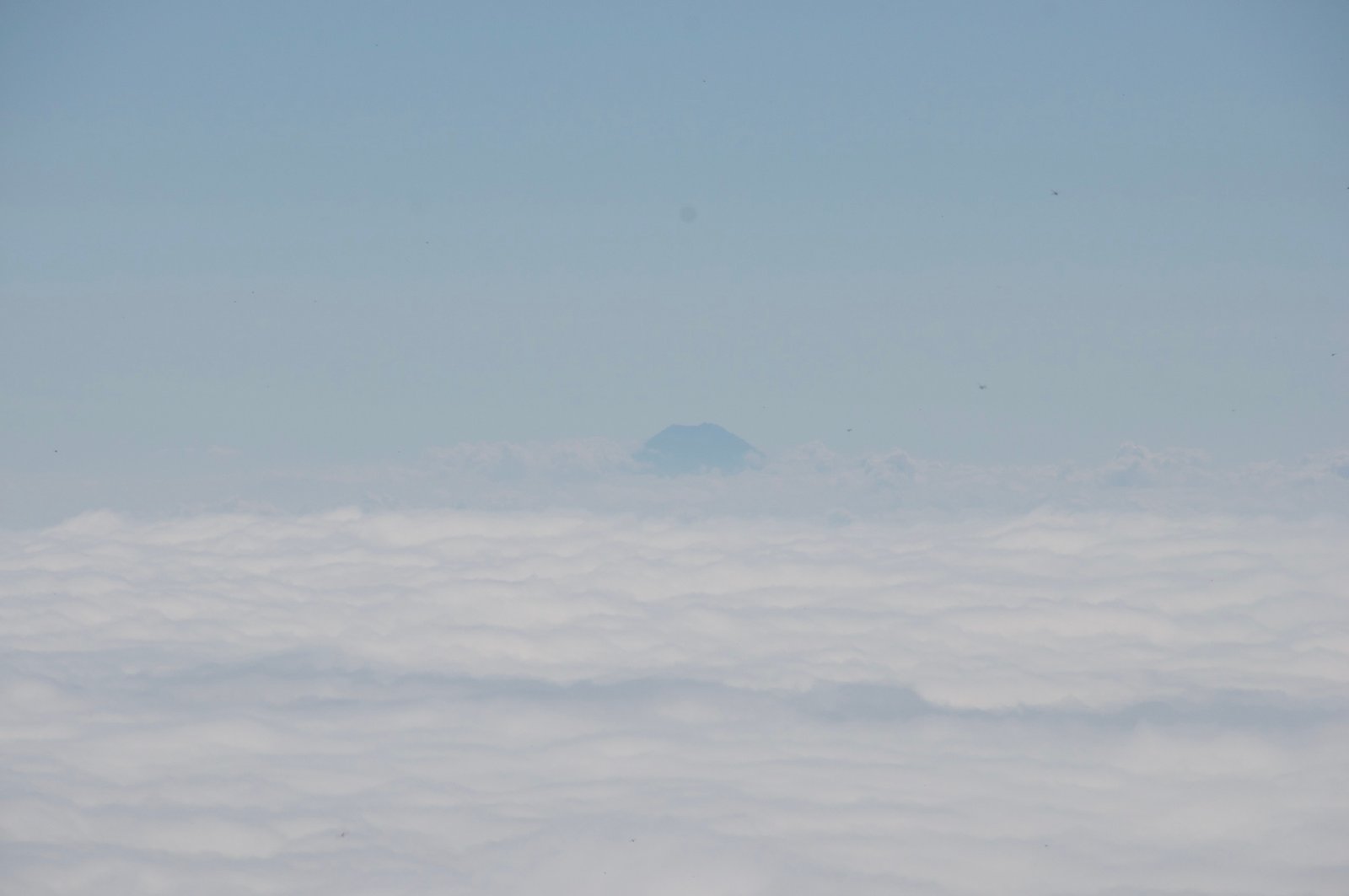 Distant Mount Fuji seen from the summit of Mount Nantai, Nikko Japan