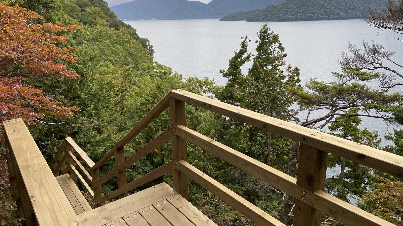 Wooden observation deck above Lake Chuzenji on the north shore trail, Nikko Japan
