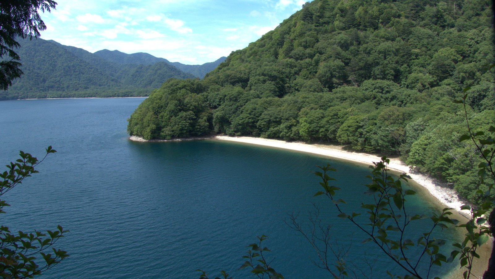 Wide view of Tochikubo cove and Lake Chuzenji from the north shore trail, Nikko Japan